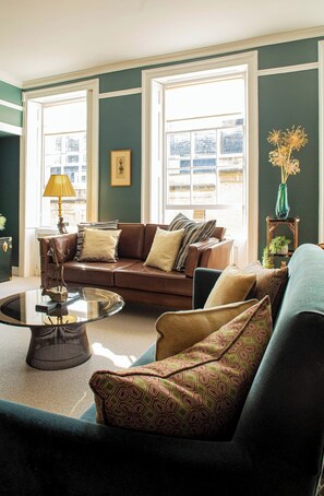 3 large sash windows fill the apartment with light