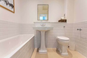 Bathroom with shower over Bath