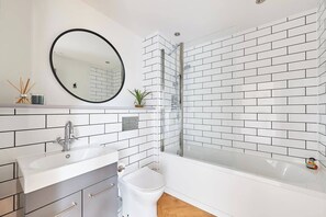 Luxurious bathroom with bath and shower