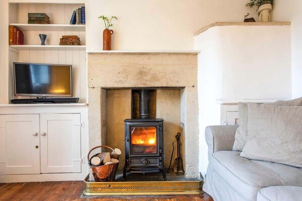 Cosy living room with wood burning fireplace