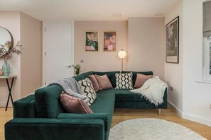 Fabulous living room with rich green sofa (bed)