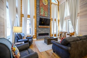 Open living area with ample seating, and Smart TV