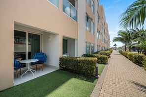 Welcoming patio with cozy seating, steps from the pool