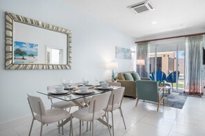 Gather around this elegant glass top dining table, perfect for sharing meals and memories