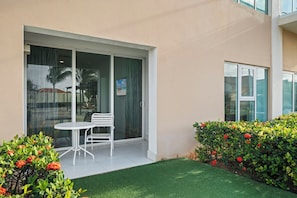 Your own patio steps from the pool