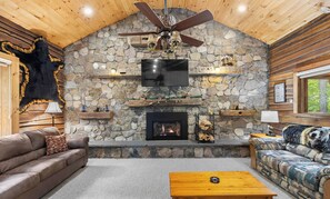 The fireplace and hearth are the highlight of the cozy living room
