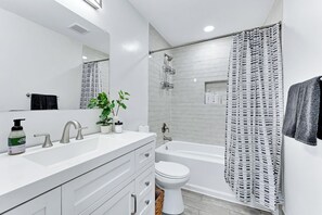 Both bathrooms have a tub/shower combo