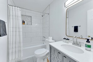 Both bathrooms have a tub/shower combo
