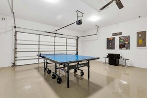 Modern game room with Arcade games and table tennis.