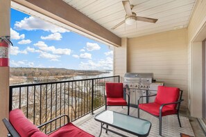 - Fire up the grill and enjoy al fresco meals with sweeping lake and sky views
- Bold red cushions and a ceiling fan create a breezy spot for lounging anytime
- Covered balcony invites slow mornings, sunset chats, and memorable BBQ nights