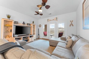 - Settle into the sectional & catch your favorite show on the TV
- Thoughtfully styled with playful touches, perfect for cozy nights or laid back mornings
- French Door open to a balcony where you can relax, sip coffee, & take in peaceful lake views