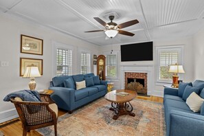 A warm and welcoming fireplace sets the tone for cozy evenings or mornings.