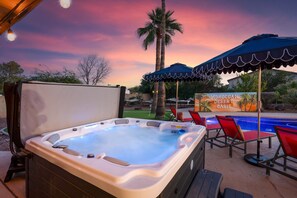 Whether you're swimming or soaking, the hot tub beside the pool provides the ultimate spot to relax.