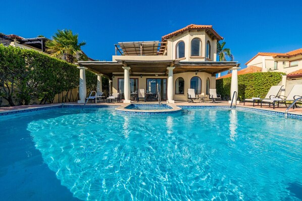 Welcome to Miramar 15: Your serene escape with a stunning poolside view and inviting architecture. Relax and unwind in paradise!