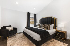 One King bed in the Bedroom. Cozy seat for relaxing, Full length mirror, Closet with hangers and shelf, Nightstands to store your items in.