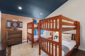 Two twin bunkbeds in the Bedroom. Closet with hangers and shelf, Dresser and Nightstands to store your items in + Darts game board.