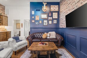 Western style living room with lots of natural light! Smart TV with all the apps you could want. The couch turns into a pullout sofa. Rustic and unique decor throughout the entire condo!