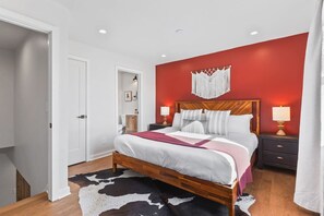 Bedroom 1 has One King Bed with its own attached full bathroom. Room darkening curtains, Full length mirror, Bench for comfortable seating, Closet with hangers and shelf, Nightstands to store your belongings in.