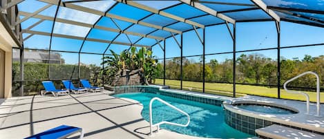 Unwind beneath the screened lanai on this spacious sundeck featuring a sparkling pool and spa—perfect for sun-soaked days and peaceful evenings.