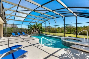 Unwind beneath the screened lanai on this spacious sundeck featuring a sparkling pool and spa—perfect for sun-soaked days and peaceful evenings.