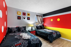Fun room with full-sized beds, ideal for kids or friends to enjoy a cozy, shared space.