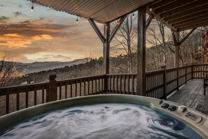 Soak in the bubbling hot tub while taking in an unforgettable mountain sunset—pure relaxation with a view that steals the show.