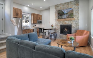 Living room & kitchen - Open living room, kitchen and dining area.  Gas fire place, SmartTV.