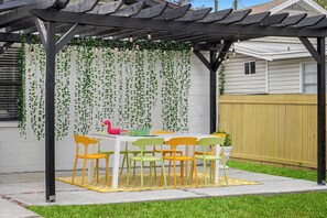 Patio with outdoor dining area for 8 with eclectic vibes