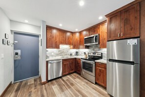 The remodeled kitchen come equipped with full sized stainless steel appliances