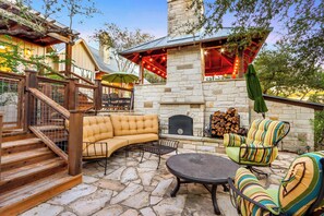 Gather around the outdoor fireplace on a chilly evening