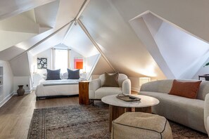 Comfortable sitting area in the loft bedroom of Unit 3, featuring cozy armchairs and a sofa, all within the same open room as the king beds. Perfect for relaxing after enjoying the Stratford Festival or exploring downtown Stratford’s shops, galleries, and