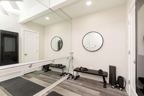 Mirror, mirror on the wall, this workout room's got it all!