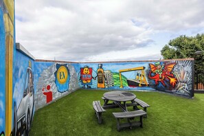 No time to see all the sights? Snap a selfie on our rooftop! This vibrant mural by a Belfast artist features numerous NI icons — from cranes to Tayto crisps. How many can you spot?