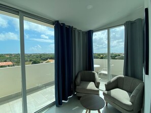 Sip your morning coffee or unwind with a drink while soaking in breathtaking views - Floor to ceiling windows fill this cozy lounge with natural light & fresh air - Step onto the balcony for a front row seat to endless blue skies & landscapes