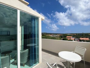 Soak up the sun and fresh air on your private rooftop terrace with breathtaking views - Start your morning with coffee or unwind under the stars in this peaceful retreat - Perfect spot to relax, dine, and take in the beauty of your surroundings