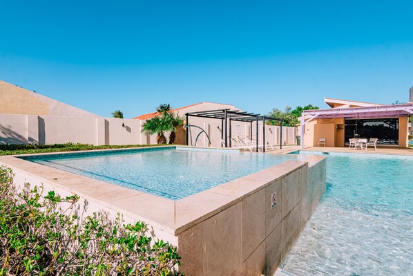 Soak in the infinity pool vibes with sunny skies and tropical breezes all around.