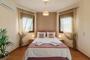 Master Bedroom Comfort: A cozy queen-size bed in the elegant master bedroom with soft natural light.