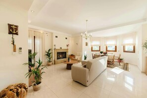 Spacious Living Room: A bright and welcoming living area with tasteful decor, ideal for family moments.