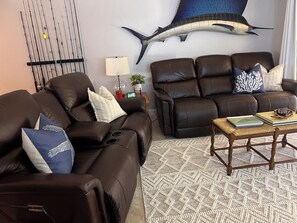 Two comfortable reclining leather couches