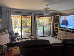 Main living area looking towards the back porch and water