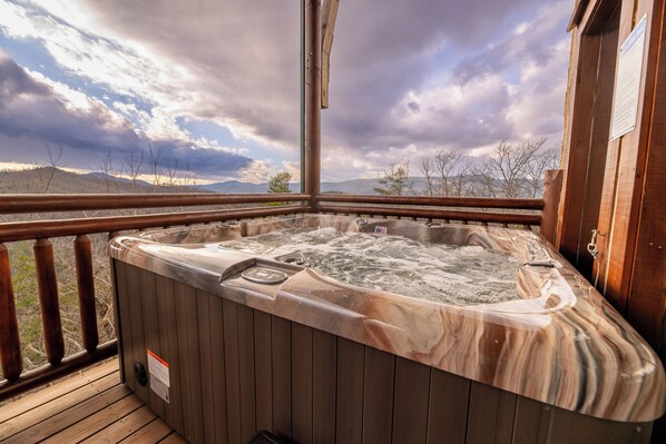 Relax and let the hot water and jets from the hot tub soothe your muscles as the blue skies and mountains soothe your soul.