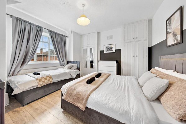 A close-up of the bed, with stylish decor and calming colours that promote relaxation and restfulness.