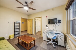 Indoors, Screen, Ceiling Fan, Furniture, Table