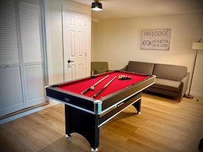 Pool table in the basement gameroom