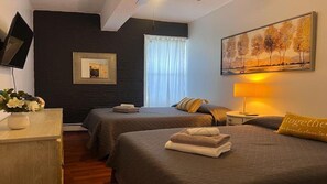 Bedroom # 5 , apartment # 1 : ( 2 double beds ) ceiling, fans, window, AC, TV, dresser