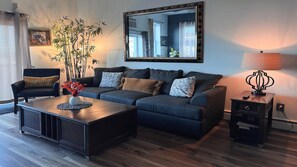 Living room, apartment # 1 , pull out queen size, ceiling, fan, TV, window, AC, large dining table