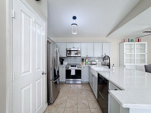 Prepare your home cooked meal in our Fullu Equipped Kitchen