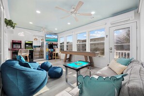 Game Room: Shuffleboard, Infinity Table, TV and Four Arcade Games. 