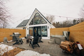 Enjoy this beautiful back deck with fire pit, gas grill, and HOT TUB!