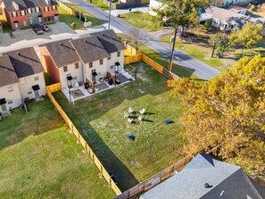 Fenced backyard with individual patios